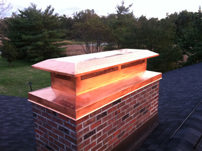 Before and after chimney cap replacement in East Northport, NY