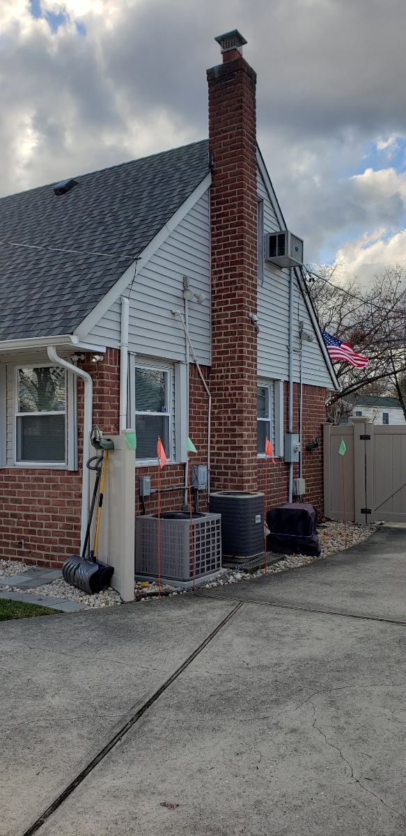 Professional chimney repointing restoring brick joints in East Northport, NY