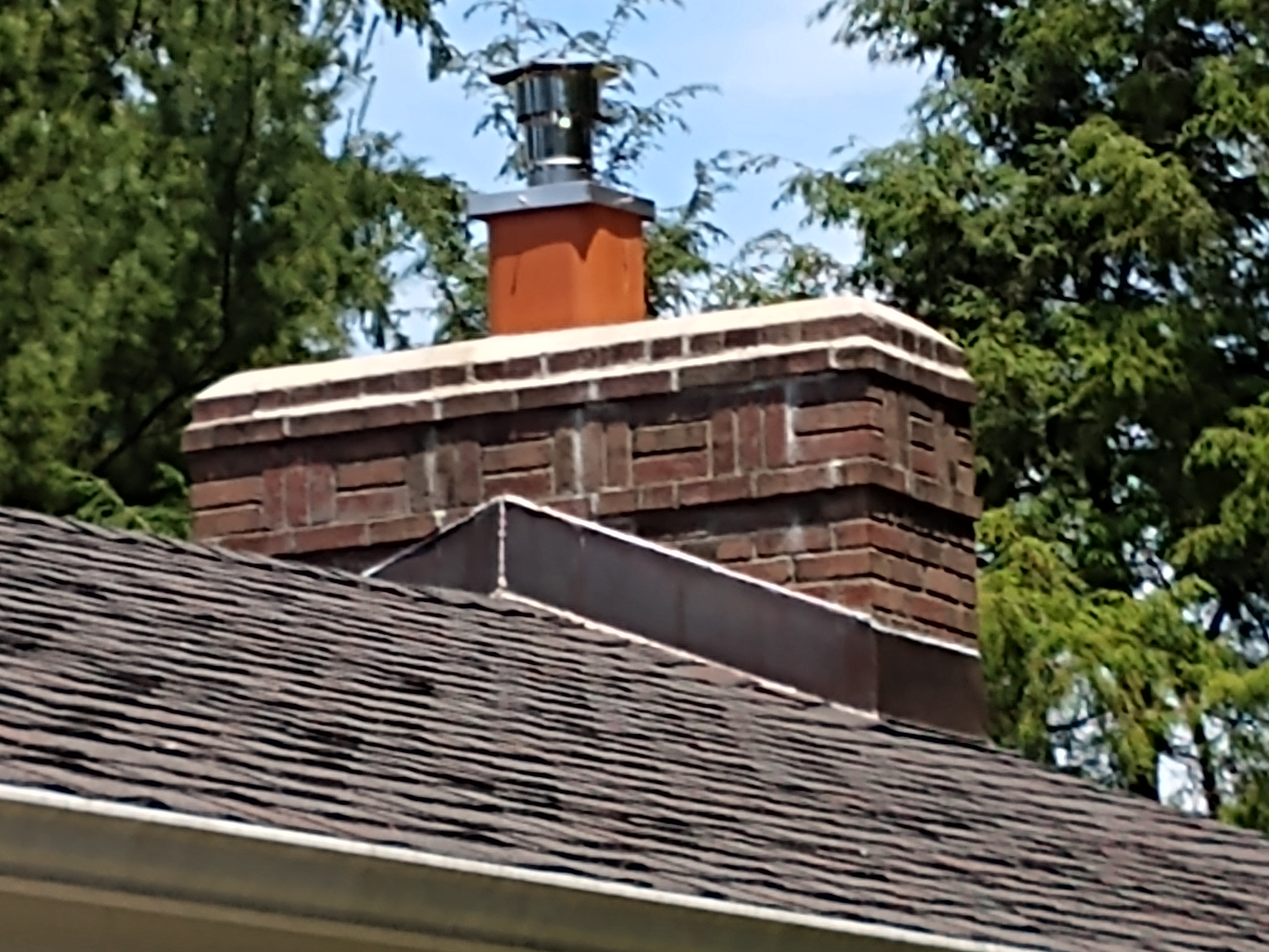 Stainless steel chimney cap with animal guard in East Northport, New York